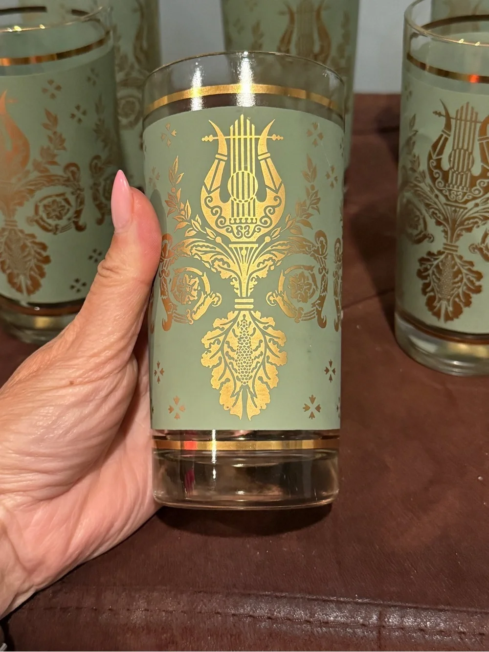 Set of 6 glasses vintage green and gold design. Holds 8 ounces
